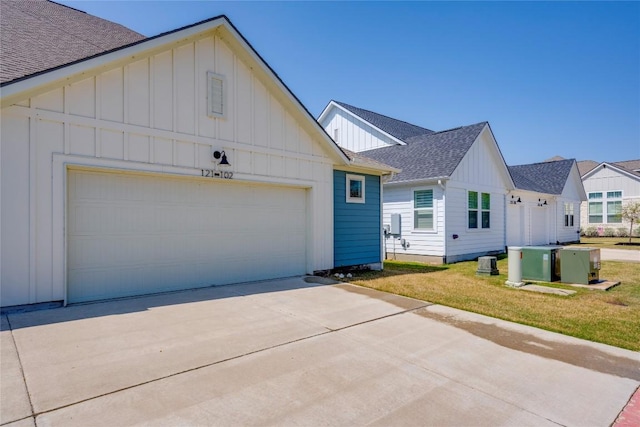 121 Harborside Dr Unit 102, San Marcos, TX 78666 - modern farmhouse with board and batten siding, a shingled roof, driveway, and an attached garage