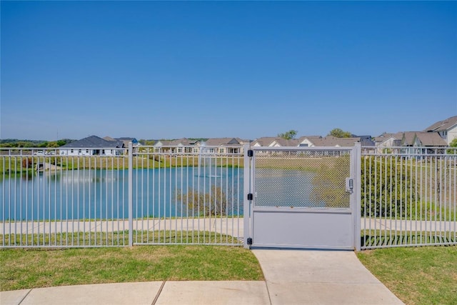 exterior space featuring a residential view, a gate, and fence