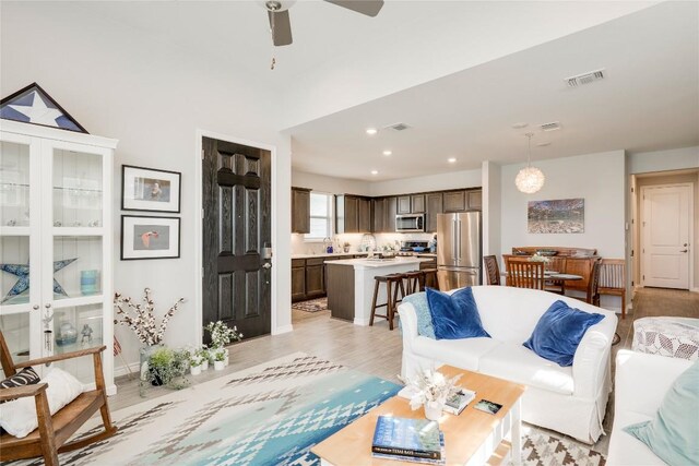 121 Harborside Dr Unit 102, San Marcos, TX 78666 - living area with a ceiling fan, light wood-style floors, and recessed lighting