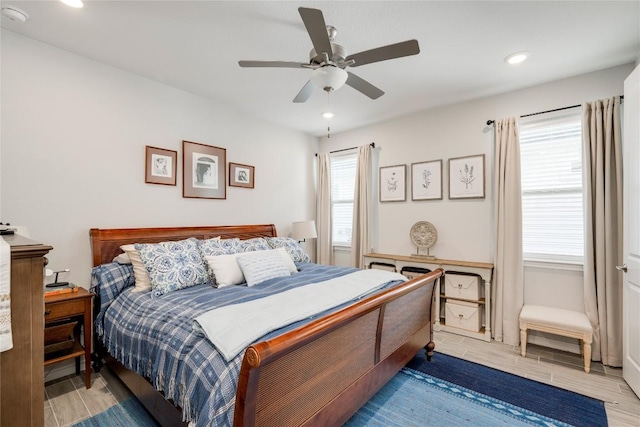 bedroom featuring recessed lighting, ceiling fan, and wood tiled floor