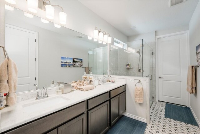121 Harborside Dr Unit 102, San Marcos, TX 78666 - full bathroom featuring double vanity, a stall shower, and tile patterned floors