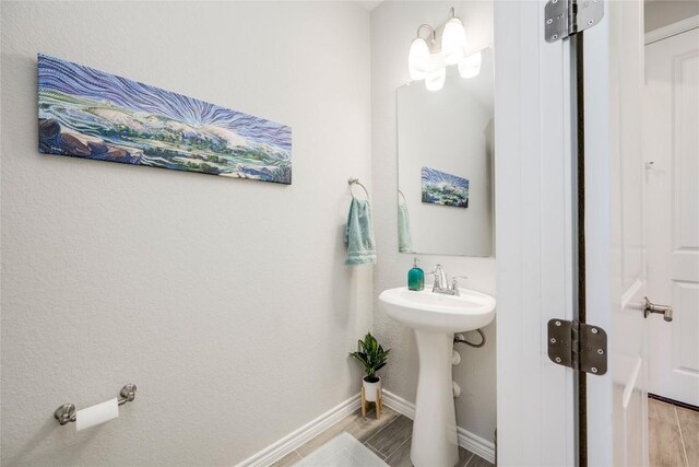 121 Harborside Dr Unit 102, San Marcos, TX 78666 - bathroom with wood finished floors and baseboards