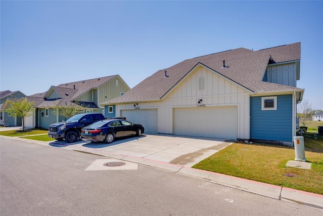 view of front facade with a garage, a front lawn, board and batten siding, driveway, and a shingled roof