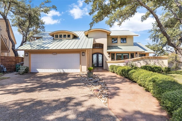 4508 Knapp Holw, Austin, TX 78731 - view of front of property with french doors, a standing seam roof, stucco siding, and metal roof