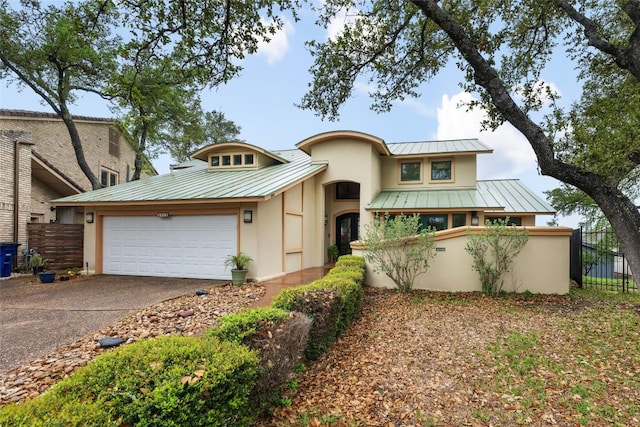 4508 Knapp Holw, Austin, TX 78731 - view of front facade with a standing seam roof, metal roof, stucco siding, and driveway