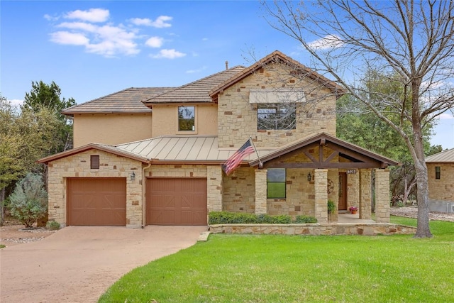 view of front facade featuring concrete driveway, stone siding, a front yard, metal roof, and a standing seam roof