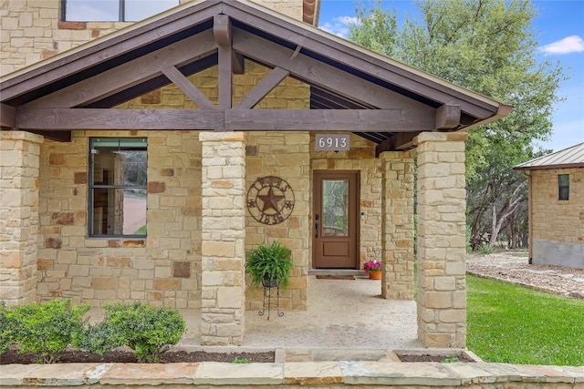 entrance to property with stone siding