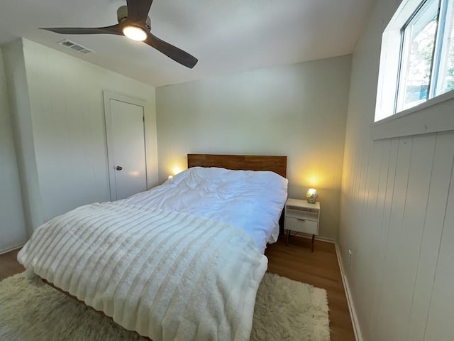 421 E Briarway Dr, Marble Falls, TX 78654 - bedroom with wood finished floors, ceiling fan, and baseboards