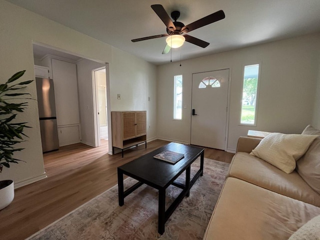 421 E Briarway Dr, Marble Falls, TX 78654 - living area featuring wood finished floors, ceiling fan, and baseboards