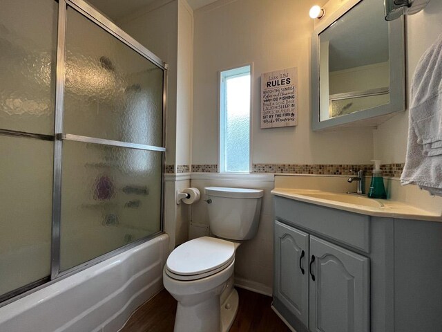 421 E Briarway Dr, Marble Falls, TX 78654 - full bathroom with vanity, shower / bath combination with glass door, and wood finished floors