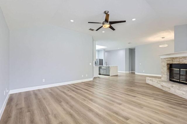 unfurnished living room featuring recessed lighting, baseboards, light wood-style floors, visible vents, and a ceiling fan