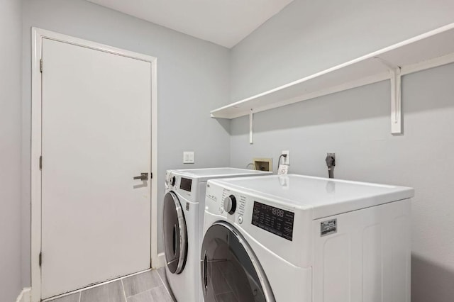 laundry room with independent washer and dryer and laundry area