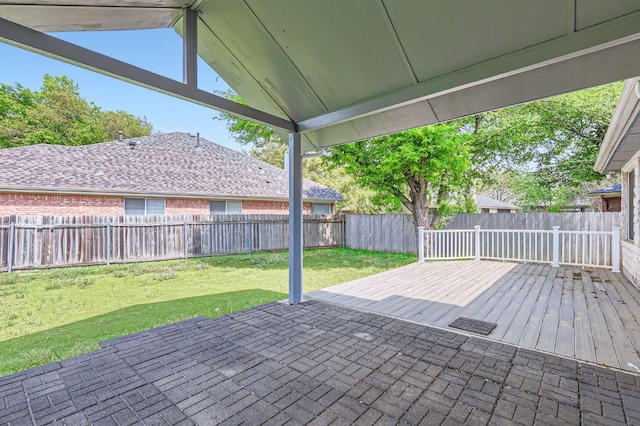 view of patio with a fenced backyard and a deck