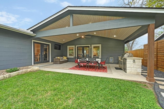 7511 Saint Cecelia St, Austin, TX 78757 - back of property with french doors, area for grilling, and a patio area