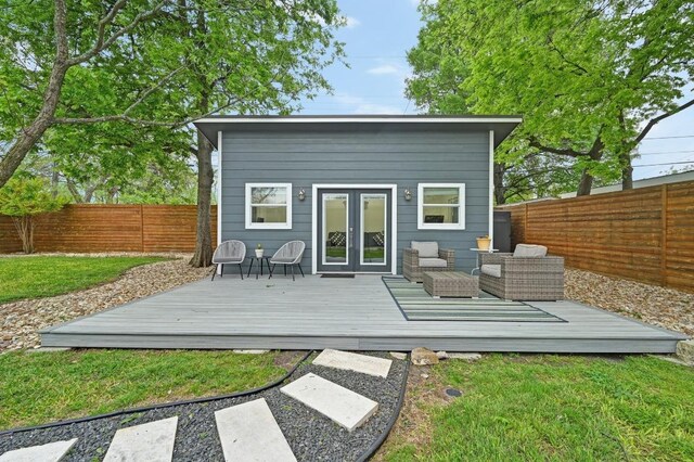7511 Saint Cecelia St, Austin, TX 78757 - back of property with french doors, a wooden deck, and an outdoor hangout area