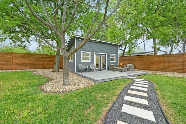 7511 Saint Cecelia St, Austin, TX 78757 - rear view of house featuring a deck, french doors, and an outdoor hangout area