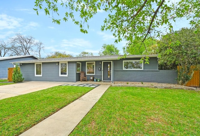 7511 Saint Cecelia St, Austin, TX 78757 - ranch-style house featuring brick siding and a porch