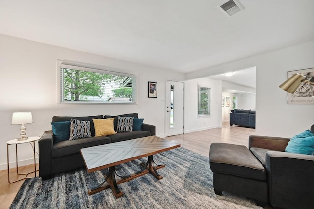 7511 Saint Cecelia St, Austin, TX 78757 - living room featuring wood finished floors and baseboards