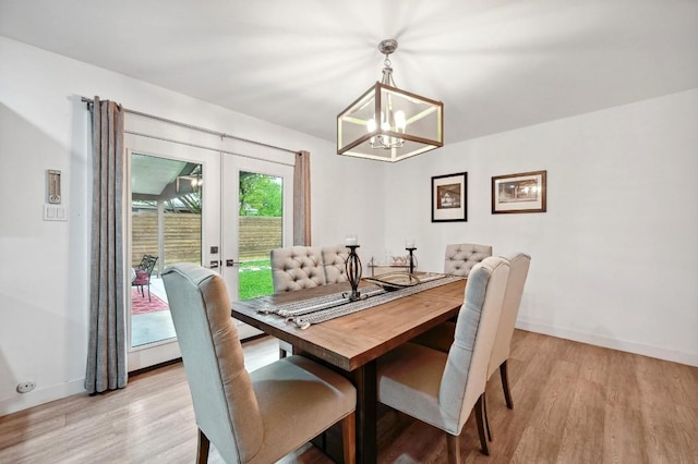 7511 Saint Cecelia St, Austin, TX 78757 - dining space featuring a chandelier, light wood-style floors, baseboards, and french doors