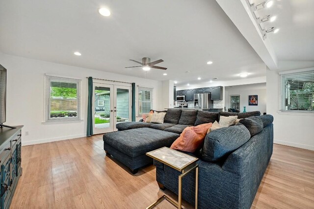 7511 Saint Cecelia St, Austin, TX 78757 - living room featuring light wood-style floors, french doors, baseboards, and recessed lighting