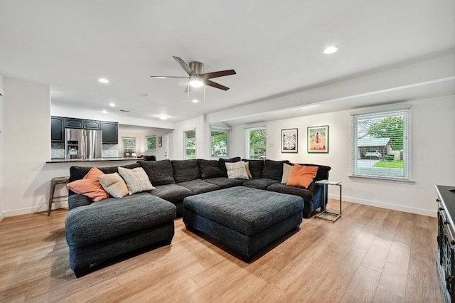 7511 Saint Cecelia St, Austin, TX 78757 - living room with light wood finished floors, a ceiling fan, baseboards, and recessed lighting