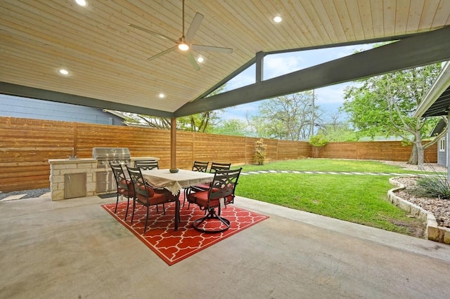 7511 Saint Cecelia St, Austin, TX 78757 - view of patio / terrace featuring exterior kitchen, outdoor dining space, and area for grilling