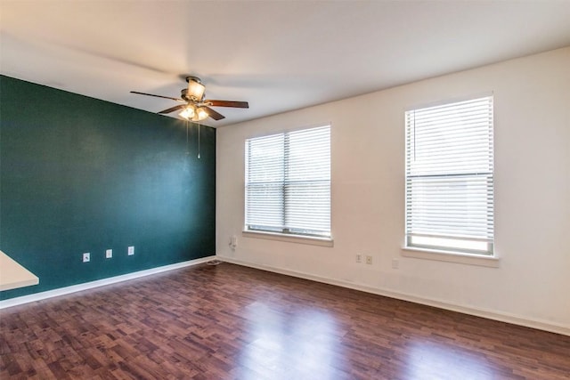 1201 Grove Blvd Unit 702, Austin, TX 78741 - empty room with a ceiling fan, wood finished floors, and baseboards