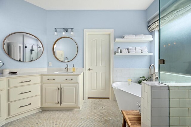 7721 Journeyville Dr, Austin, TX 78735 - bathroom with vanity, a freestanding bath, tile patterned flooring, and a stall shower