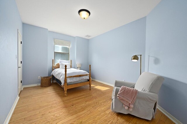 7721 Journeyville Dr, Austin, TX 78735 - bedroom with light wood-style floors and baseboards