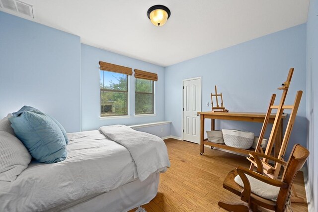 7721 Journeyville Dr, Austin, TX 78735 - bedroom with wood finished floors and baseboards