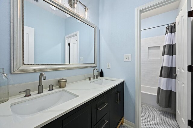 7721 Journeyville Dr, Austin, TX 78735 - bathroom featuring double vanity, shower / bath combination with curtain, and tile patterned floors