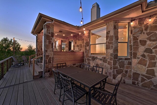 7721 Journeyville Dr, Austin, TX 78735 - deck at dusk with outdoor dining area