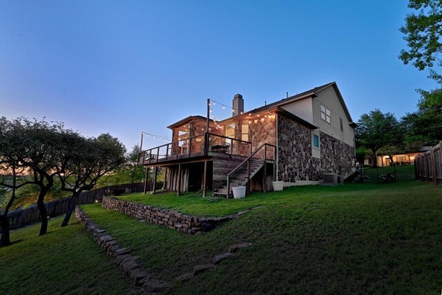 7721 Journeyville Dr, Austin, TX 78735 - back of property featuring stairway, stone siding, a deck, a chimney, and central AC
