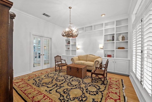 5305 Cuesta Verde, Austin, TX 78746 - living area featuring ornamental molding, light wood-type flooring, french doors, and a chandelier