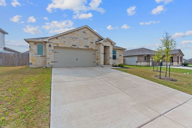 ranch-style house featuring concrete driveway, fence, an attached garage, stone siding, and a front lawn