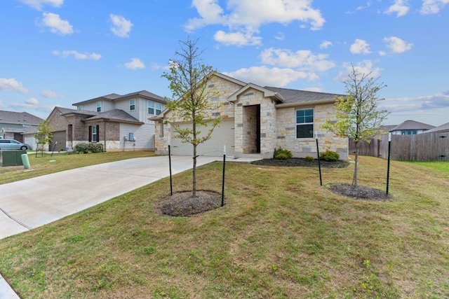 view of front of home featuring stone siding, fence, a garage, concrete driveway, and a front lawn