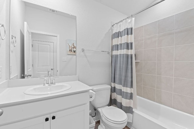 full bath featuring shower / bath combo, visible vents, toilet, and vanity