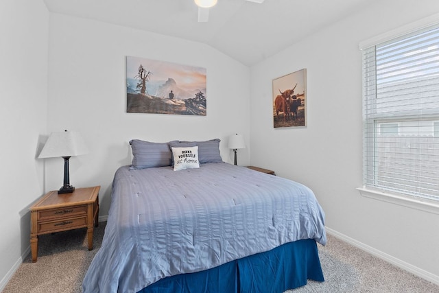 carpeted bedroom with baseboards, lofted ceiling, and ceiling fan