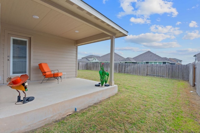 view of yard featuring a patio and a fenced backyard