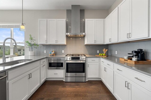 4501 Jackson Ave Unit 5205, Austin, TX 78731 - kitchen with appliances with stainless steel finishes, wall chimney range hood, a sink, decorative backsplash, and dark wood-style flooring