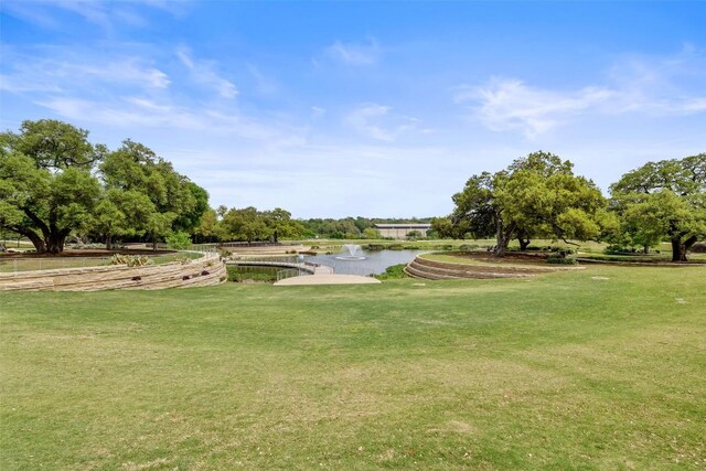 4501 Jackson Ave Unit 5205, Austin, TX 78731 - view of property's community with a yard, a water view, and view of scattered trees