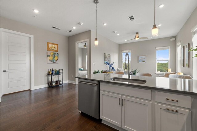 4501 Jackson Ave Unit 5205, Austin, TX 78731 - kitchen with stainless steel dishwasher, a sink, dark wood-style floors, recessed lighting, and ceiling fan