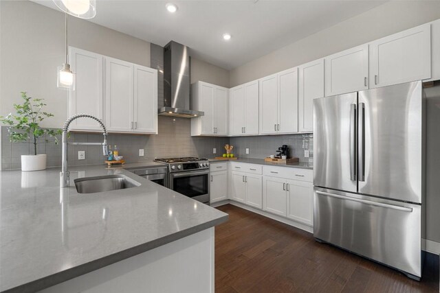 4501 Jackson Ave Unit 5205, Austin, TX 78731 - kitchen with stainless steel appliances, wall chimney exhaust hood, a sink, dark wood-style flooring, and tasteful backsplash
