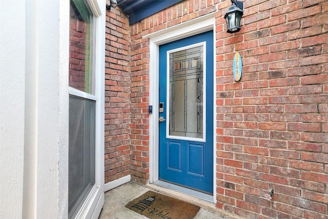 16 Tournament Way Unit 19, The Hills, TX 78738 - doorway to property with brick siding