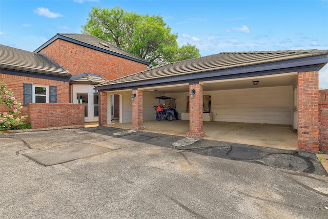 16 Tournament Way Unit 19, The Hills, TX 78738 - view of side of home featuring brick siding and a tiled roof