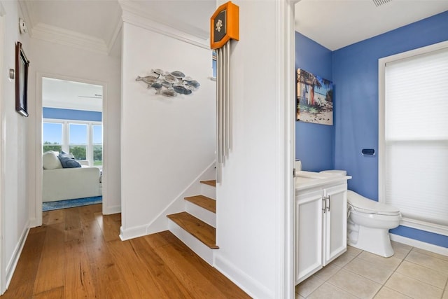 16 Tournament Way Unit 19, The Hills, TX 78738 - stairs with ornamental molding and wood finished floors