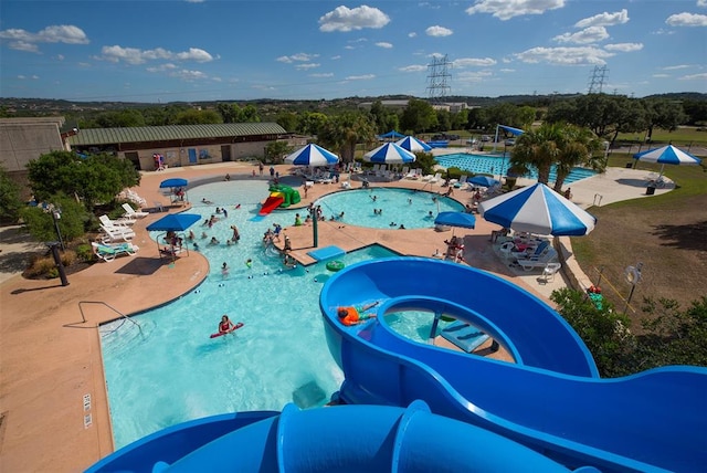 16 Tournament Way Unit 19, The Hills, TX 78738 - community pool featuring a water slide and a patio