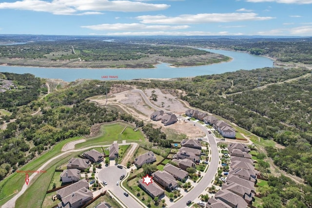 aerial view with a view of trees, a residential view, and a water view