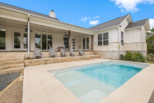 6601 N Lakewoods Dr, Georgetown, TX 78633 - rear view of house with french doors, board and batten siding, a ceiling fan, and a chimney