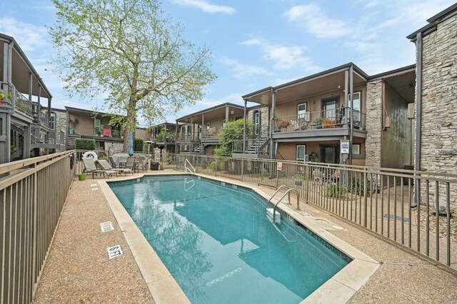 5820 Berkman Dr Unit 119, Austin, TX 78723 - community pool featuring fence, a residential view, and a patio